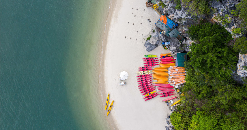 Kayaking to explore the beaches in Halong Bay