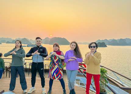 Get up early to exercise and watch the sunrise on Halong Bay