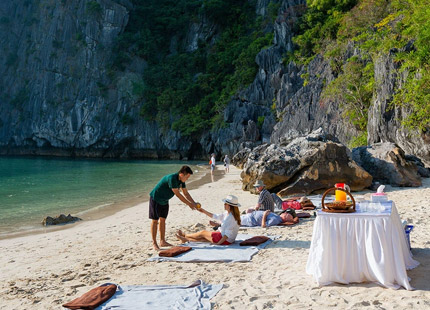 Take a swim in the crystal-clear waters of the Three Peaches beach (Ba Trai Dao Beach) area