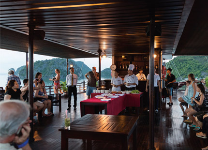 At the sunset party & cooking class on the sundeck, our chef will guide you step by step to make fresh Vietnamese spring rolls